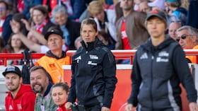 27 April 2025, Berlin: Soccer, Women: Bundesliga 2, 1. FC Union Berlin - Borussia Mönchengladbach, Matchday 23, An der Alten Försterei, Union's individual coach Marie-Louise Eta (M) watches the match. On the right is her head coach Ailien Poese. Photo: Soeren Stache/dpa - IMPORTANT NOTE: In accordance with the regulations of the DFL German Football League and the DFB German Football Association, it is prohibited to utilize or have utilized photographs taken in the stadium and/or of the match in the form of sequential images and/or video-like photo series. (Photo by Soeren Stache/picture alliance via Getty Images)