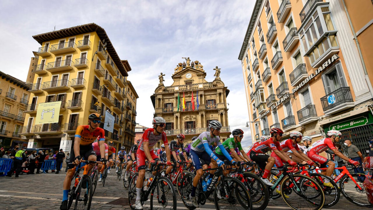 La Vuelta pack race cross in front of the City Hall at Plaza del Ayuntamiento square during the second stage of La Vuelta between Pamplona and Lekunberri, in Pamplona, northern Spain, Wednesday, Oct. 21, 2020. (AP Photo/Alvaro Barrientos)