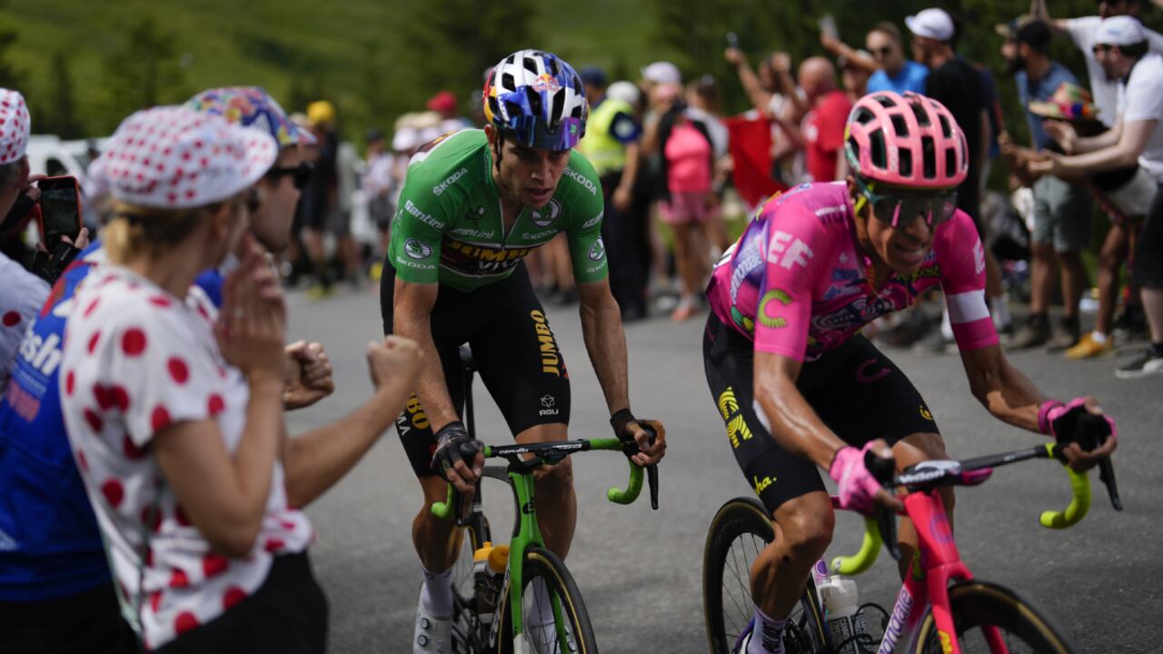 Colombia's Rigoberto Uran, right, and Belgium's Wout Van Aert, wearing the best sprinter's green jersey, climb during the ninth stage of the Tour de France cycling race over 193 kilometers (119.9 miles) with start in Aigle, Switzerland and finish in Chatel les Portes du Soleil, France, Sunday, July 10, 2022. (AP Photo/Thibault Camus)