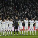 Real Madrid's team players stand on the pitch prior the Spanish La Liga soccer match between Real Madrid and Atletico Madrid at Santiago Bernabeu stadium in Madrid, Spain, Sunday, Dec. 12, 2021. (AP Photo/Bernat Armangue)
