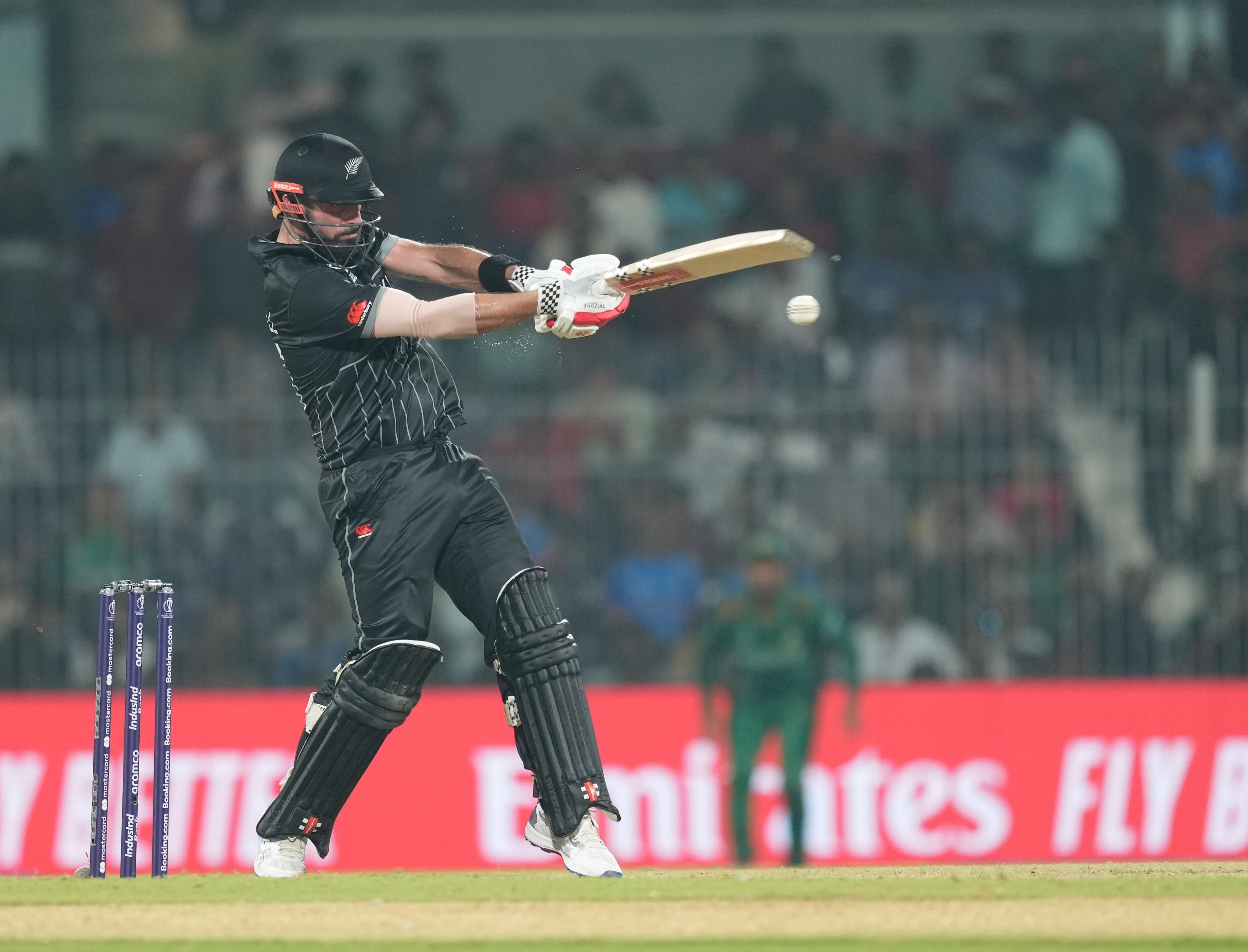 New Zealand's Daryl Mitchell plays a shot during the ICC Men's Cricket World Cup match between New Zealand and Bangladesh in Chennai , India, Friday, Oct. 13, 2023. (AP Photo/Eranga Jayawardena)