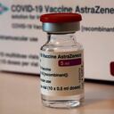 FILE - In this Monday, March 15, 2021 file photo a vial of AstraZeneca vaccine is pictured in a pharmacy in Boulogne Billancourt, outside Paris. At least a dozen countries including Germany, France, Italy and Spain have now temporarily suspended their use of AstraZeneca's coronavirus vaccine after reports last week that some people in Denmark and Norway who got a dose developed blood clots, even though there's no evidence that the shot was responsible. The European Medicines Agency and the World Health Organization say the data available don't suggest the vaccine caused the clots and that people should continue to be immunized. Here's a look at what we know — and what we don't.(AP Photo/Christophe Ena, File)