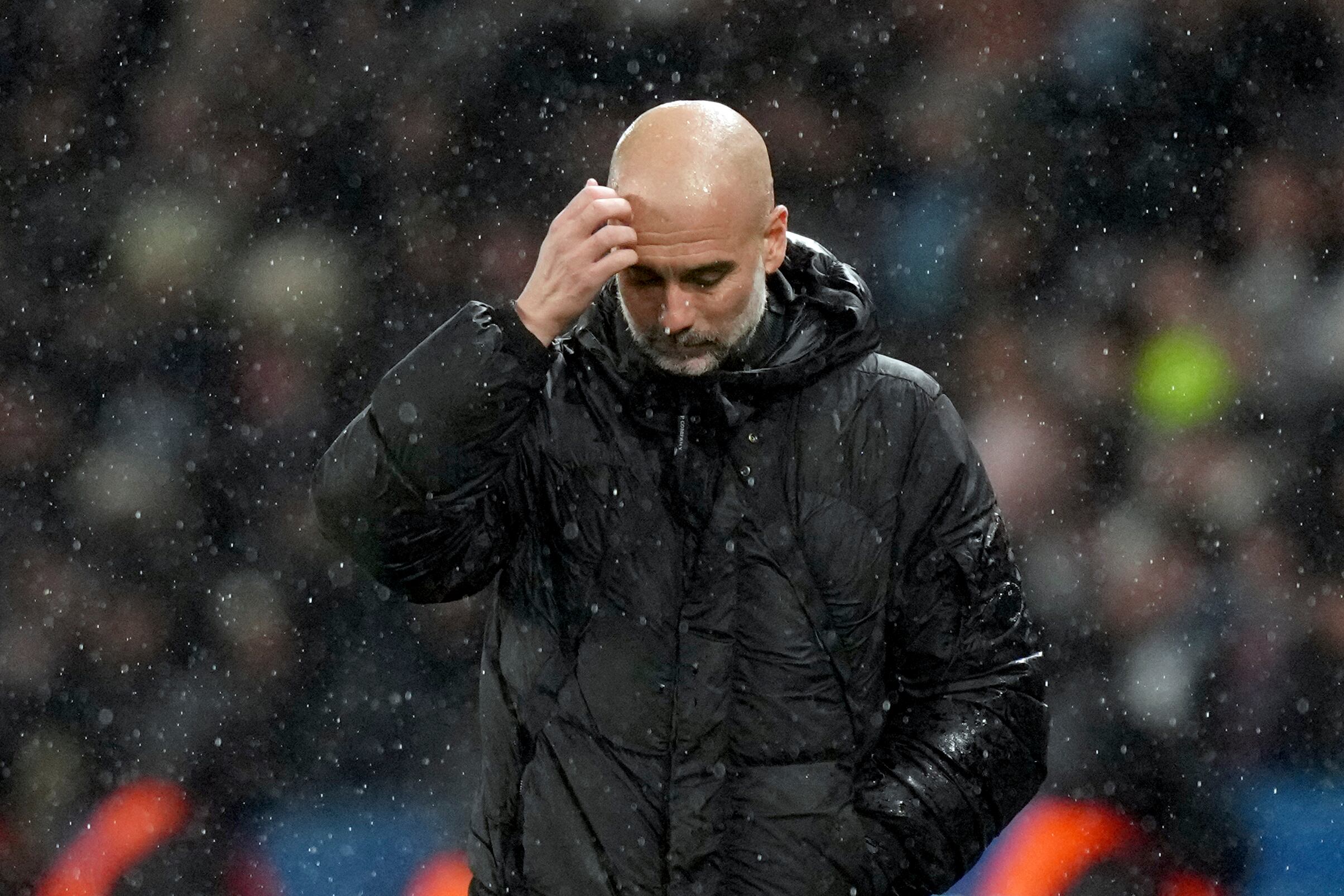 Manchester City's head coach Pep Guardiola reacts during a Champions League opening phase soccer match between Paris Saint-Germain and Manchester City at the Parc des Princes in Paris, Wednesday, Jan. 22, 2025. (AP Photo/Thibault Camus)