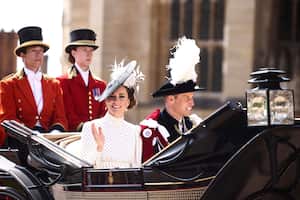 Britain's Kate, Princess of Wales and Prince William leave in a horse-drawn carriage from St George's Chapel after attending the Most Noble Order of the Garter Ceremony in Windsor Castle in Windsor, England, Monday June 19, 2023. (Henry Nicholls/Pool Photo via AP)