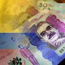 Billete de 50 mil pesos con bandera de Colombia.
