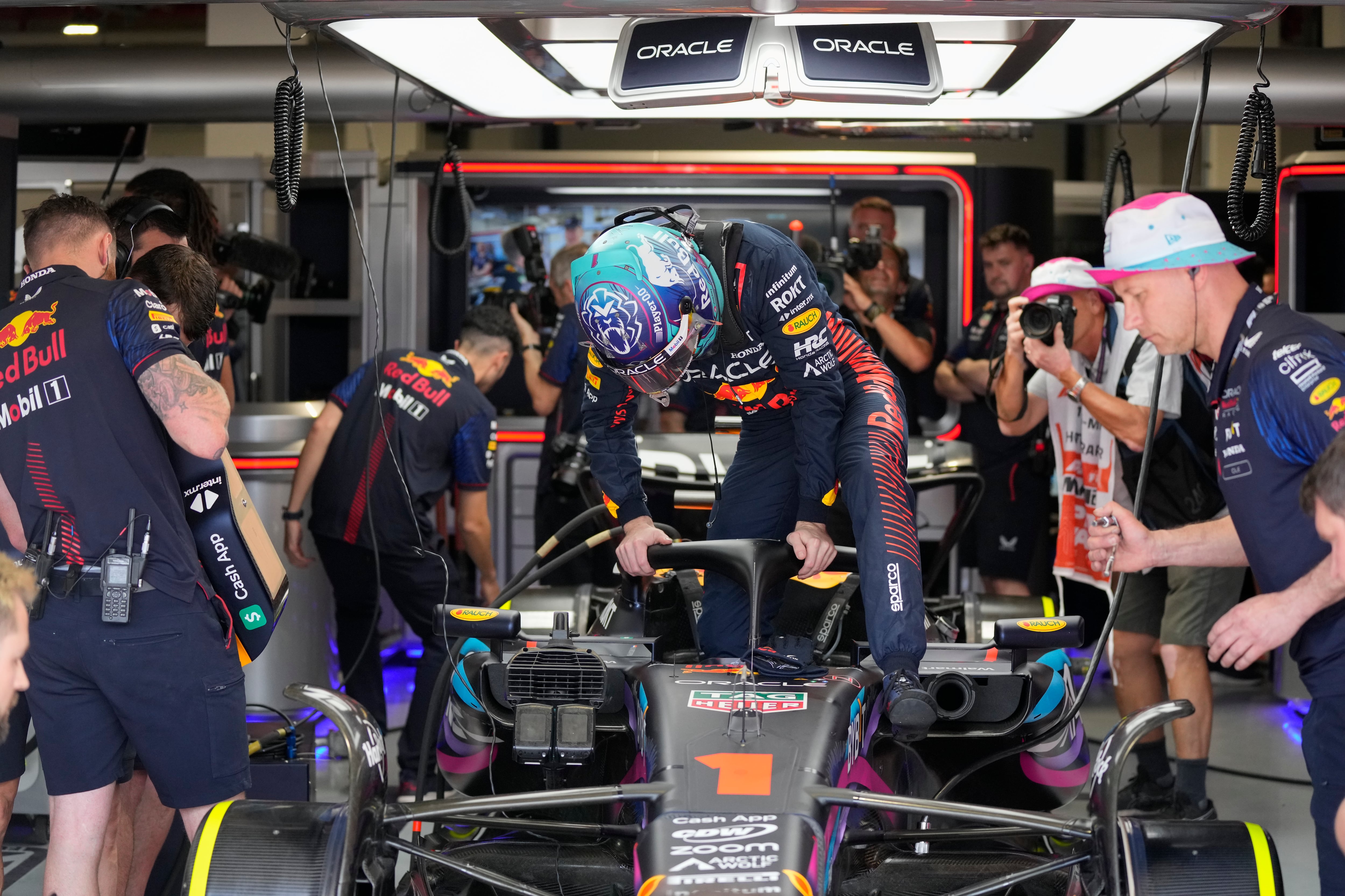 Red Bull driver Max Verstappen of the Netherlands climbs into his car for the start of the third practice session of the Formula One Miami Grand Prix auto race, at Miami International Autodrome in Miami Gardens, Fla., Saturday, May 6, 2023. (AP Photo/Rebecca Blackwell)