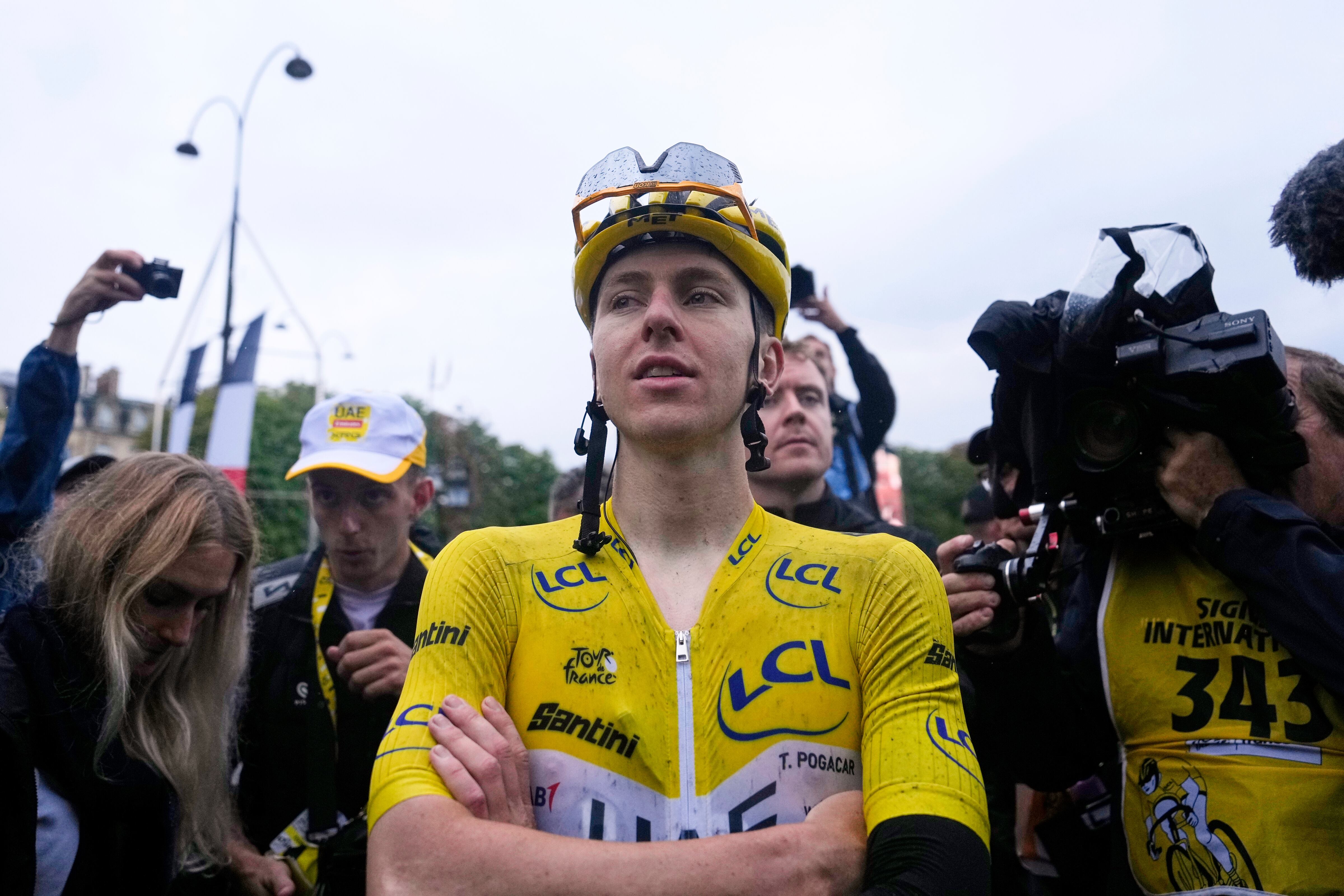 Tour de France winner Tadej Pogacar of Slovenia reacts after the twenty-first stage of the Tour de France cycling race over 132.3 kilometers (82.1 miles) with start in Mantes-la-Ville and finish on the Champs-Elysees in Paris, France, Sunday, July 27, 2025. (AP Photo/Mosa'ab Elshamy)