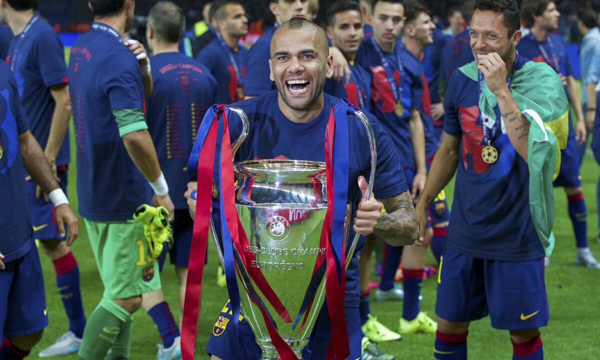 (L-R) Dani Alves of FC Barcelona with Champions League trophy, Adriano of FC Barcelona during the UEFA Champions League final match between Barcelona and Juventus on June 6, 2015 at the Olympic stadium in Berlin, Germany.(Photo by Getty Images/VI Images)