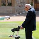 (FILES) In this file photo taken on July 17, 2020 Britain's Queen Elizabeth II uses the sword that belonged to her father, George VI as she confers the Honour of Knighthood on 100-year-old WWII veteran Captain Tom Moore at Windsor Castle in Windsor, west of London on July 17, 2020. - Britain's lockdown hero, Captain Tom Moore has died at the age of 100 after testing positive for Covid-19. The charity fundraiser was taken to Bedford Hospital on Sunday after testing positive for coronavirus last week. (Photo by Chris Jackson / POOL / AFP)