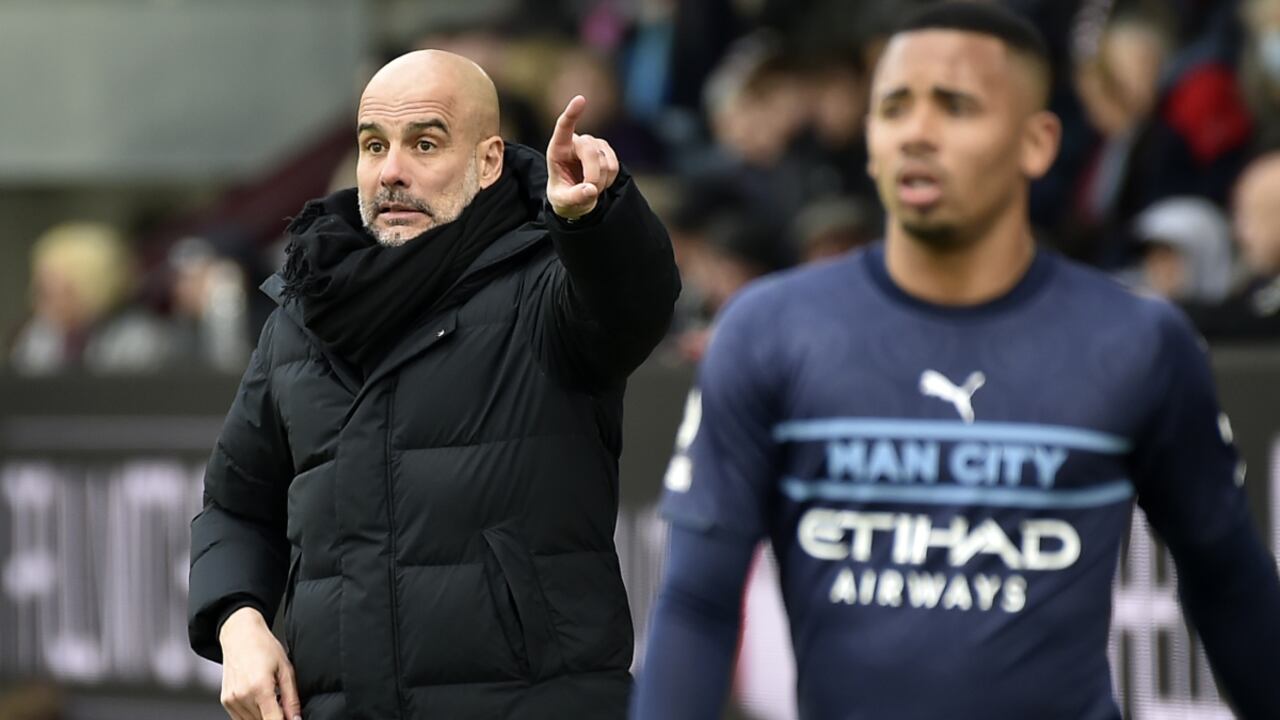 Manchester City's head coach Pep Guardiola instructs his players during the Premier League soccer match between Burnley and Manchester City at Turf Moor, in Burnley, England, Saturday, April 2, 2022. (AP/Rui Vieira)