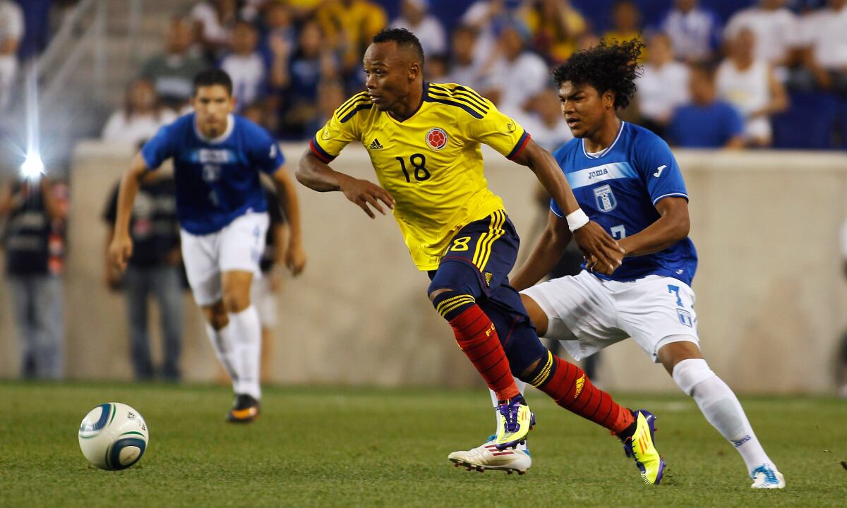 HARRISON, NJ - SEPTEMBER 03: Camilo Zuniga #18 of Colombia plays the ball in front of Mario Chavez #7 of Honduras during an International Friendly on September 3, 2011 at Red Bull Arena in Harrison, New Jersey. Colombia defeated Honduras 2-0. (Photo by Getty Images/Mike Stobe for New York Red Bulls)