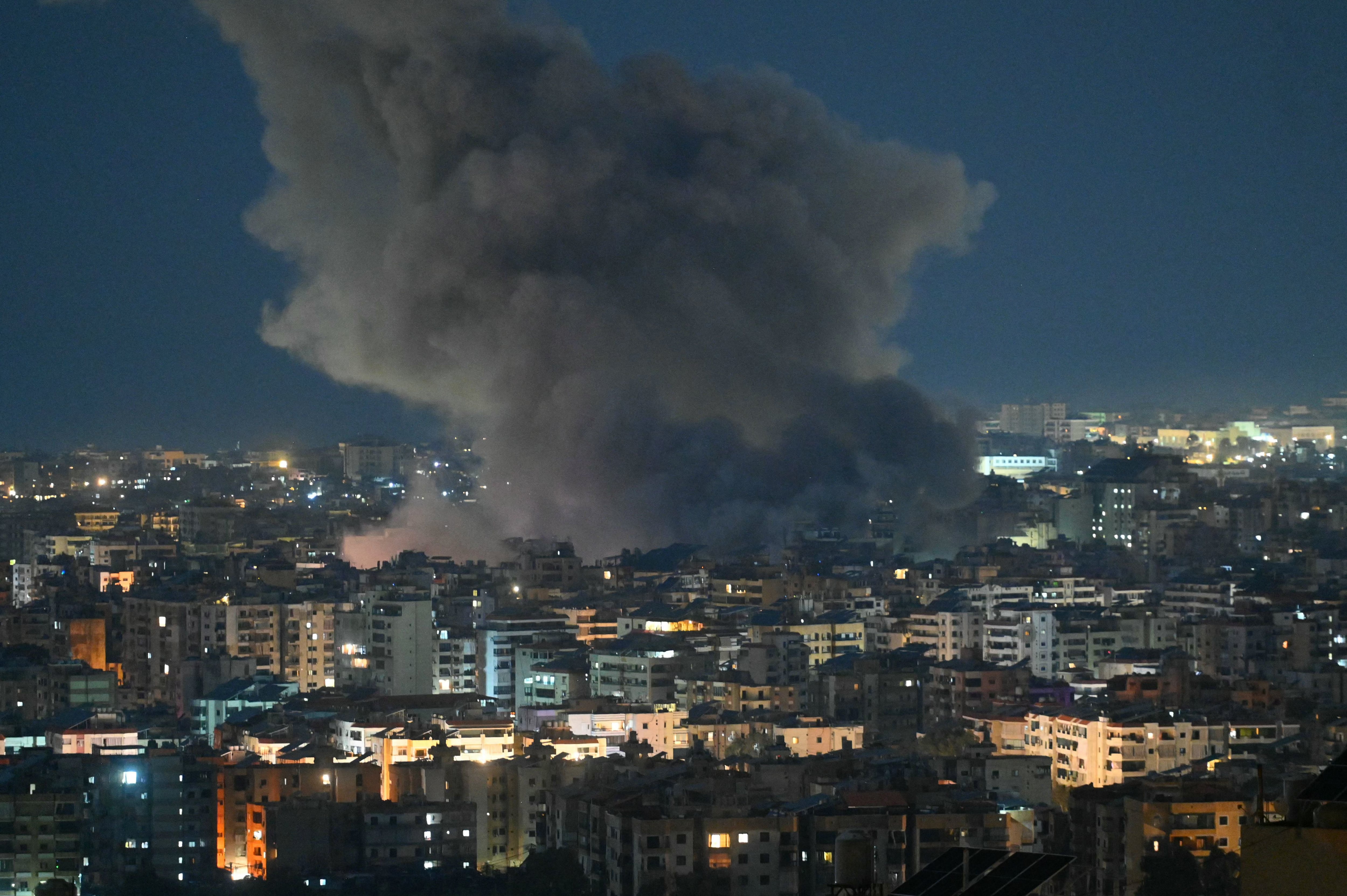 Smoke rises from the site of an Israeli airstrike that targeted the office of the Hezbollah affiliated Al-Manar TV station in Beirut�s southern suburb of Haret Hreik on March 3, 2026. An Israeli strike hit the south Beirut office of Al-Manar TV, which is affiliated with Iran-backed militant group Hezbollah, the broadcaster said on March 3. Israel "targets the Al-Manar Channel building in the Haret Hreik area," Al-Manar wrote on Telegram, referring to a part of south Beirut. (Photo by FADEL itani / AFP)