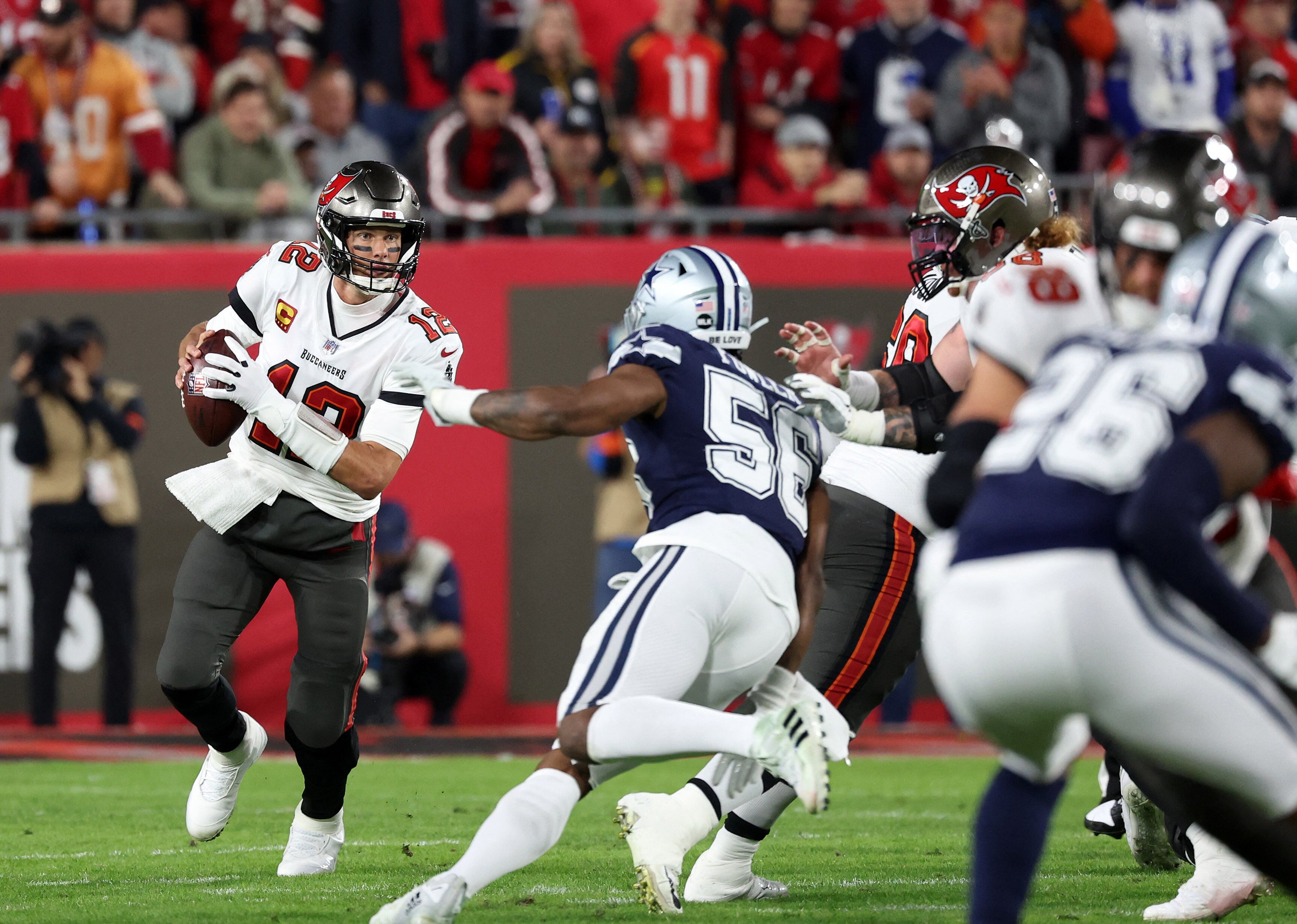 Jan 16, 2023; Tampa, Florida, USA; Tampa Bay Buccaneers quarterback Tom Brady (12) drops back to pass against the Dallas Cowboys in the first half during the wild card game at Raymond James Stadium. Mandatory Credit: Kim Klement-USA TODAY Sports