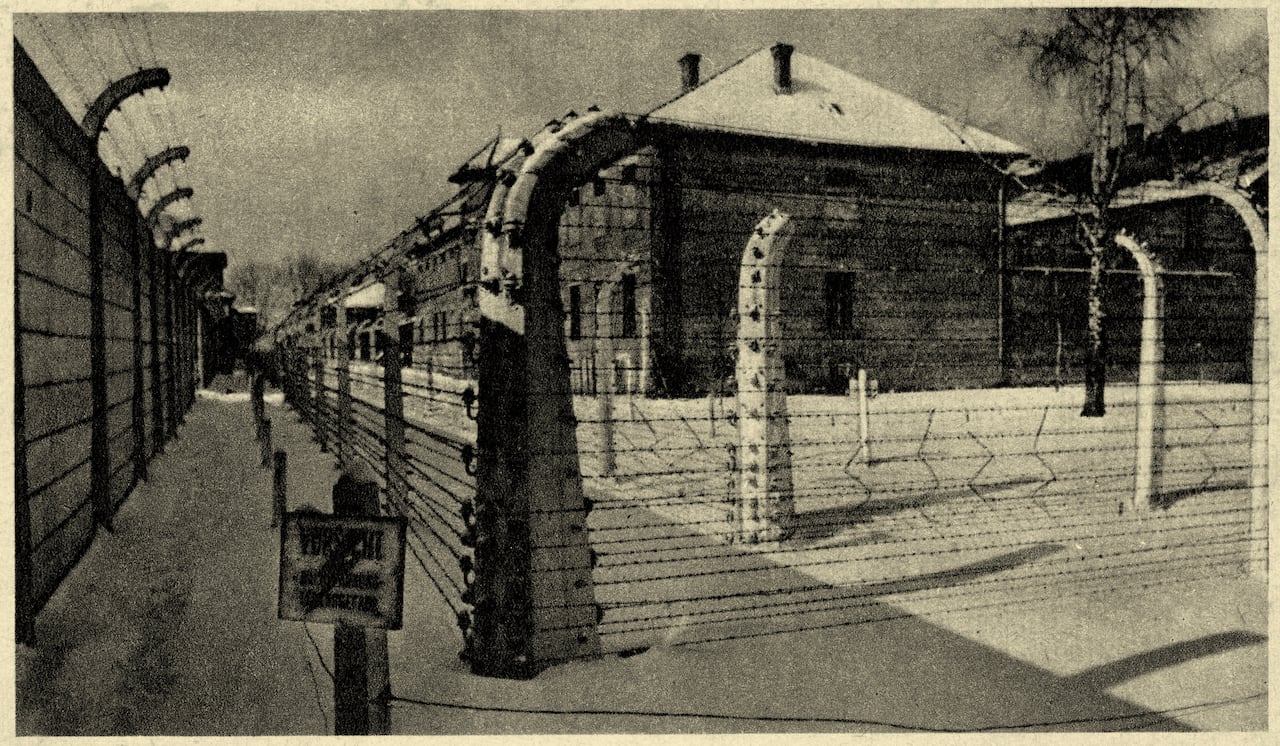 Auschwitz concentration camp -view of the 11th barrack with barbed wire. Source: Museum of O?wi?cim, Poland. - Photos taken by guard or SS. Publication date of postcard not known. Konzentrationslager Auschwitz. Site of murdered Jews. (Photo by Culture Club/Getty Images)