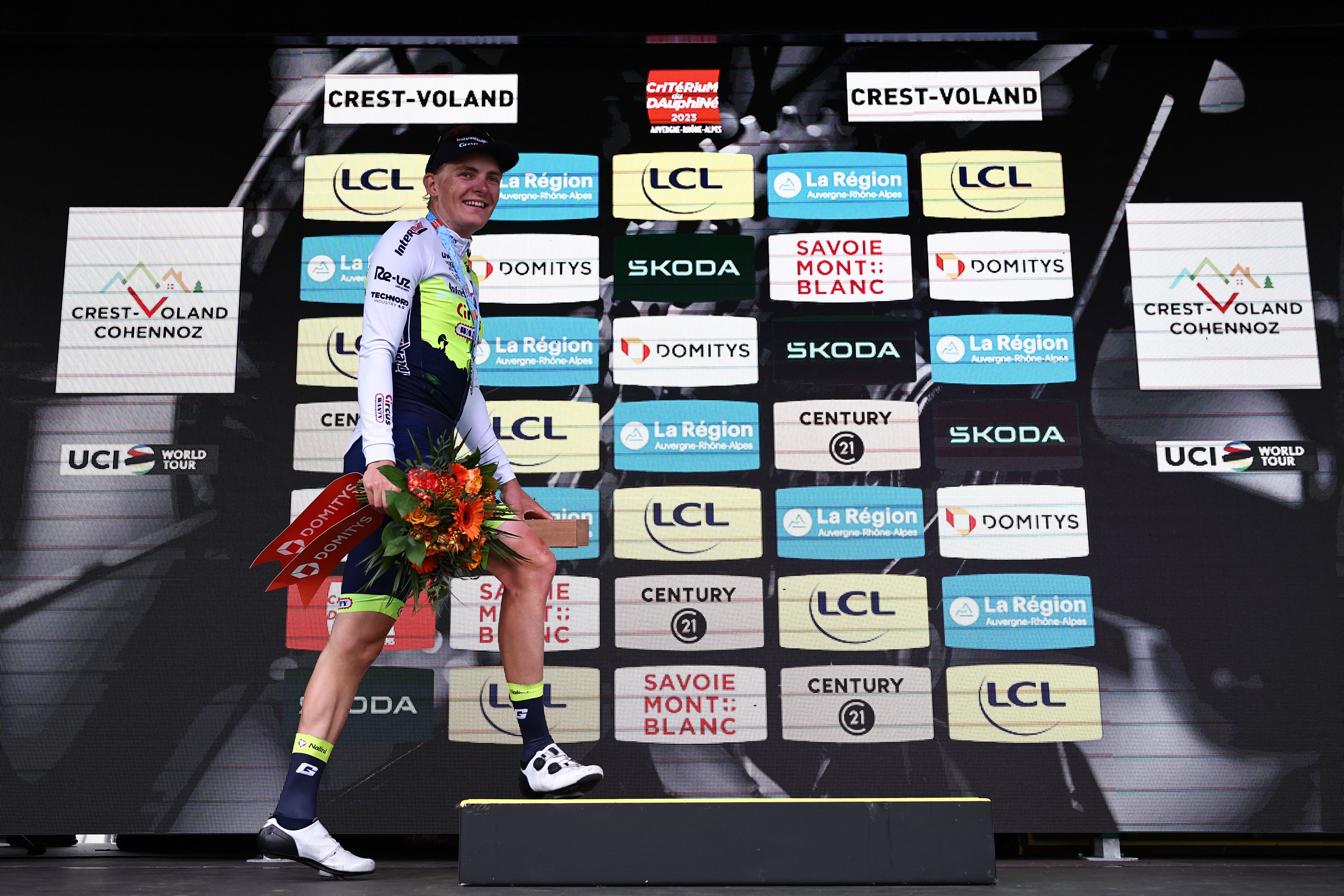 Intermarche - Circus - Wanty's German rider Georg Zimmermann walks up to the podium to celebrate after winning the sixth stage of the 75th edition of the Criterium du Dauphine cycling race, 170,5km between Nantua to Crest-Voland, France, on June 9, 2023. (Photo by Anne-Christine POUJOULAT / AFP)