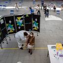 An elderly woman gets a shot of the CoronaVac vaccine for COVID-19 developed by China's biopharmaceutical company Sinovac Biotech, at a school in Santiago, Chile, Wednesday, Feb. 3, 2021. Chile is starting its vaccination plan for the general population on Wednesday, starting with seniors over 90 and health workers. (AP Photo/Esteban Felix)