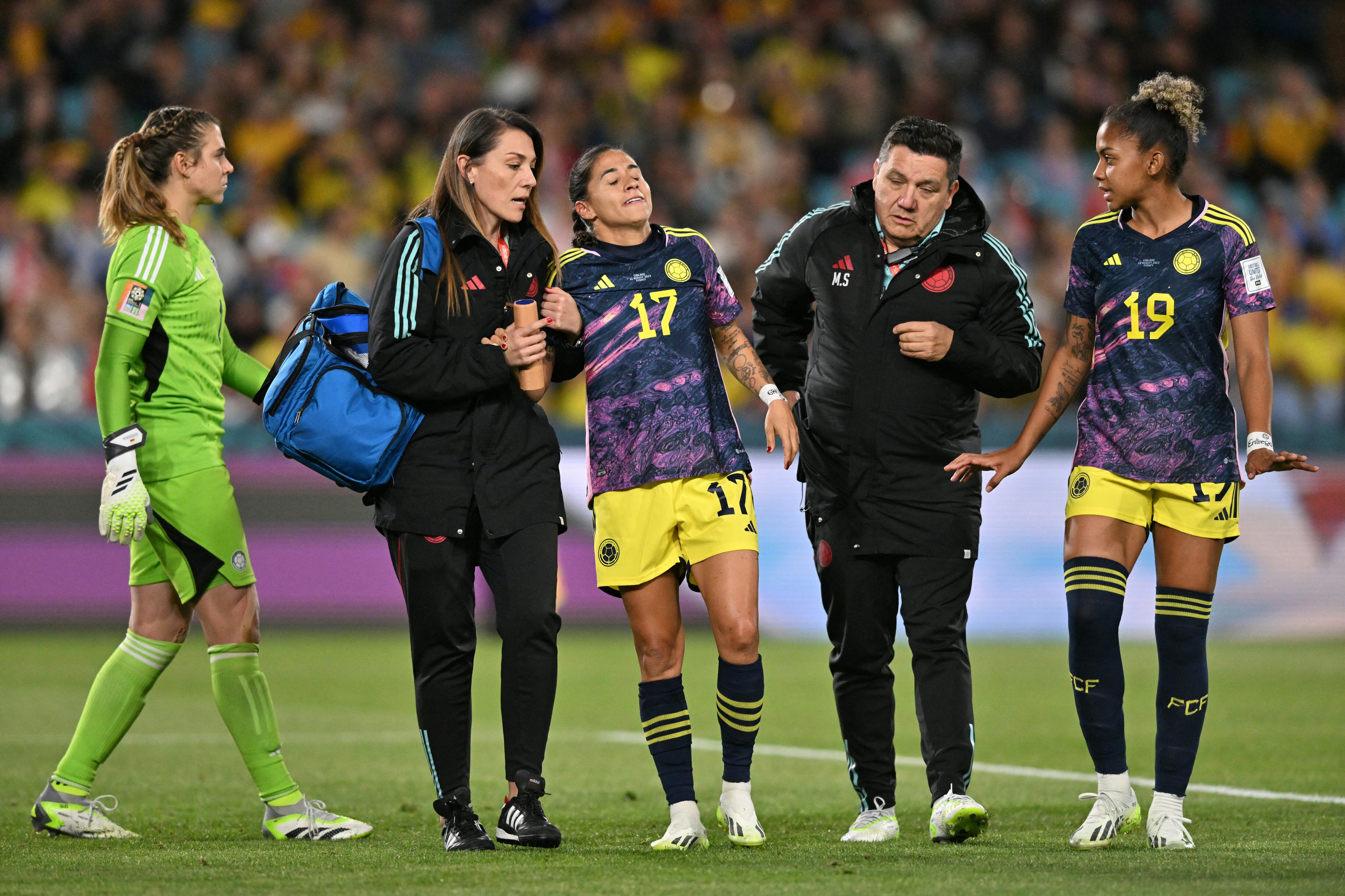 Colombia's midfielder #17 Carolina Arias leaves the pitch after picking up an injury during the Australia and New Zealand 2023 Women's World Cup quarter-final football match between Colombia and England at Stadium Australia in Sydney on August 12, 2023. (Photo by Izhar KHAN / AFP)