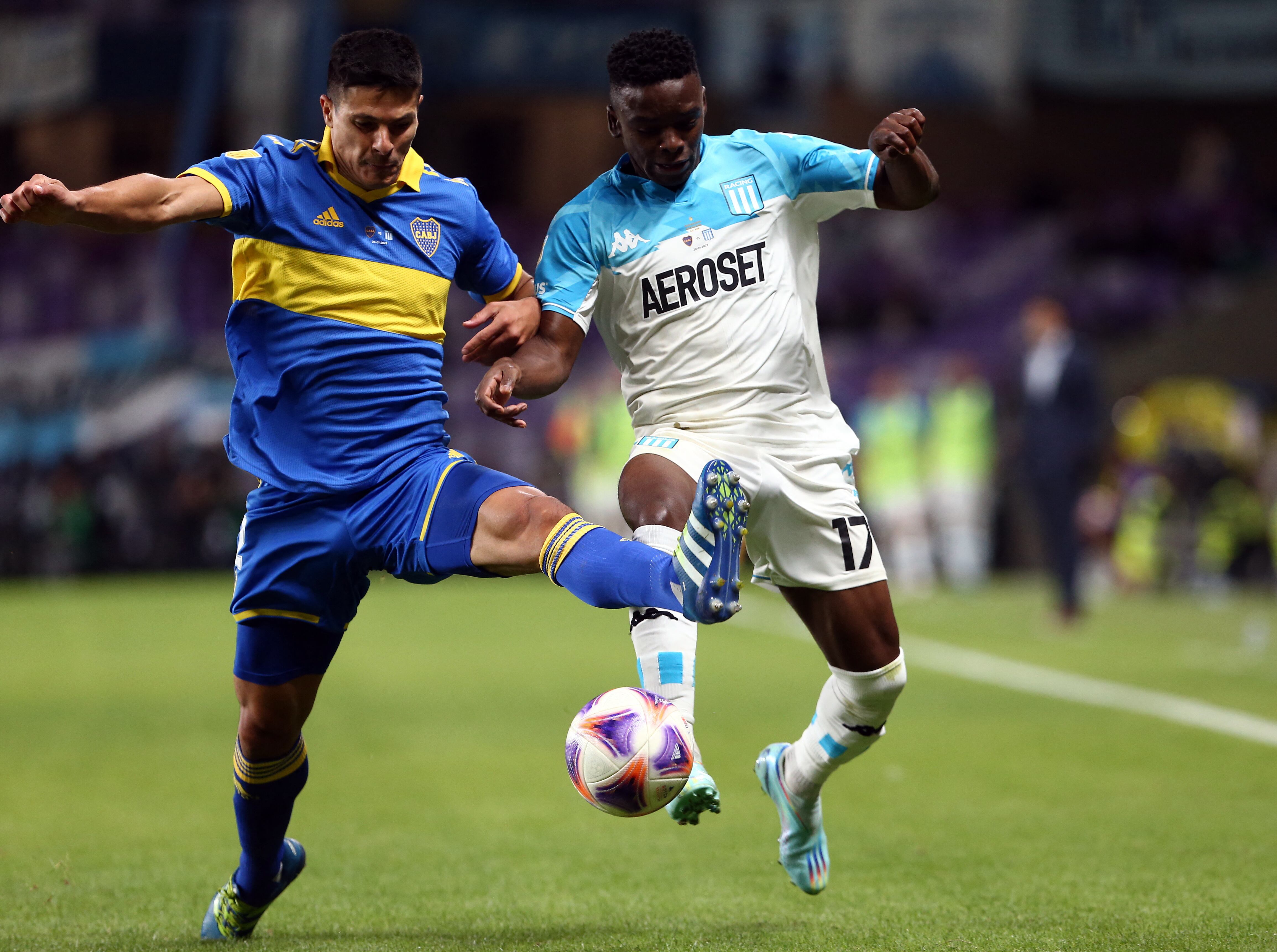 Soccer Football - Argentine Super Cup - Boca Juniors v Racing Club - Hazza bin Zayed Stadium, Al Ain, United Arab Emirates - January 20, 2023 Boca Juniors' Facundo Roncaglia in action with Racing Club's Johan Carbonero REUTERS/Satish Kumar