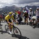 Stage winner and new overall leader Denmark's Jonas Vingegaard, left, and Slovenia's Tadej Pogacar, wearing the overall leader's yellow jersey, climb during the eleventh stage of the Tour de France cycling race over 152 kilometers (94.4 miles) with start in Albertville and finish in Col du Granon Serre Chevalier, France, Wednesday, July 13, 2022. (AP/Thibault Camus)