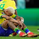 Brazil's Neymar sits on the pith after his side lost in a penalty shootout the World Cup quarterfinal soccer match between Croatia and Brazil, at the Education City Stadium in Al Rayyan, Qatar, Friday, Dec. 9, 2022. (AP Photo/Manu Fernandez)