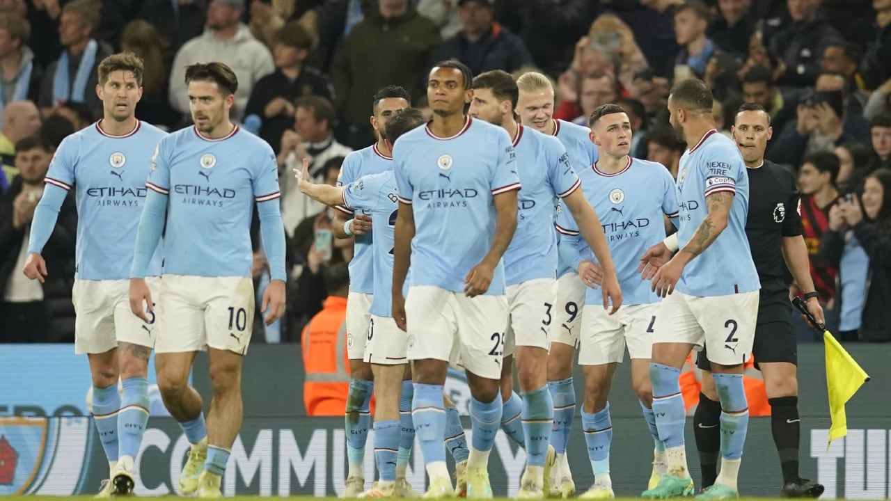Manchester City players celebrate after Manchester City's Phil Foden, second right, scored his side's third goal during the English Premier League soccer match between Manchester City and West Ham United at Etihad stadium in Manchester, England, Wednesday, May 3, 2023. (AP/Dave Thompson)