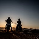 The silhouette of the riders during sunset with copy space