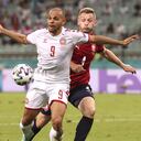 Denmark's Martin Braithwaite, left, challenges for the ball with Czech Republic's Jakub Brabec during the Euro 2020 soccer championship quarterfinal match between Czech Republic and Denmark at the Baku Olympic Stadium in Baku, Azerbaijan, Saturday, July 3, 2021. (Naomi Baker/Pool Photo via AP)