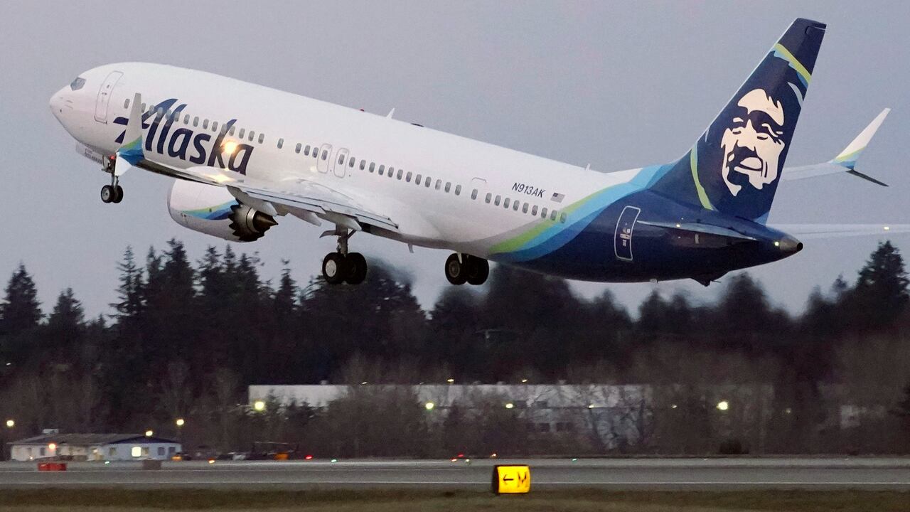 FILE - In this Monday, March 1, 2021 file photo, The first Alaska Airlines passenger flight on a Boeing 737-9 Max airplane takes off on a flight to San Diego from Seattle-Tacoma International Airport in Seattle. Many new Boeing 737 Max jetliners are still grounded by an electrical problem in a backup power-control unit. The Federal Aviation Administration said Thursday, April 22, 2021 that 106 planes worldwide are grounded, including 71 in the United States. Airlines are waiting for Boeing to come up with a plan for repairing the planes, and that plan would need FAA approval. (AP Photo/Ted S. Warren, File)