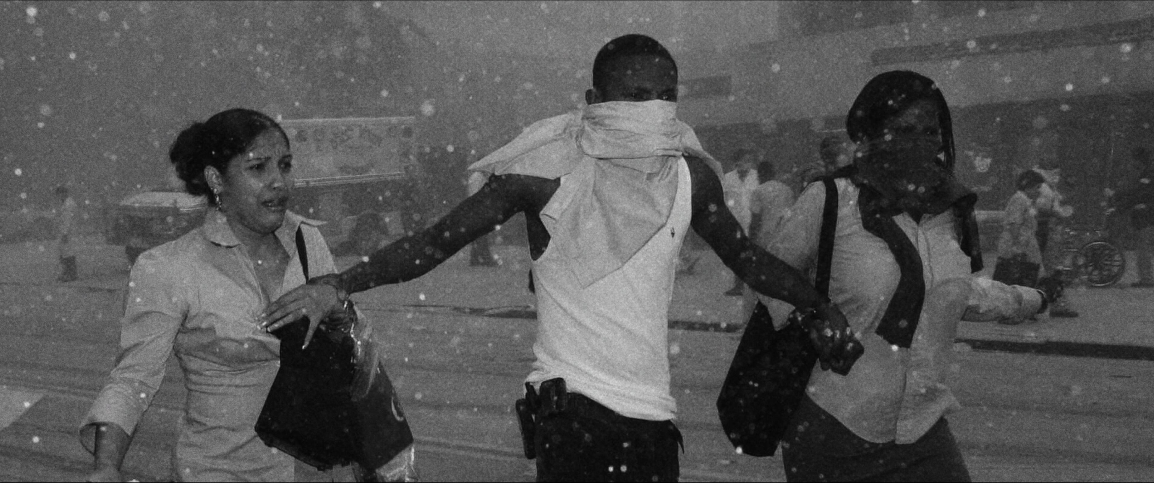 Turning Point: 9/11 and the War on Terror- Survivors of the attack covered in dust and debris from the fallen WTC towers from episode THE SYSTEM WAS BLINKING RED, Season 1 of Turning Point: 9/11 and the War on Terror. Credit: Courtesy of NETFLIX / ©NETFLIX 2021