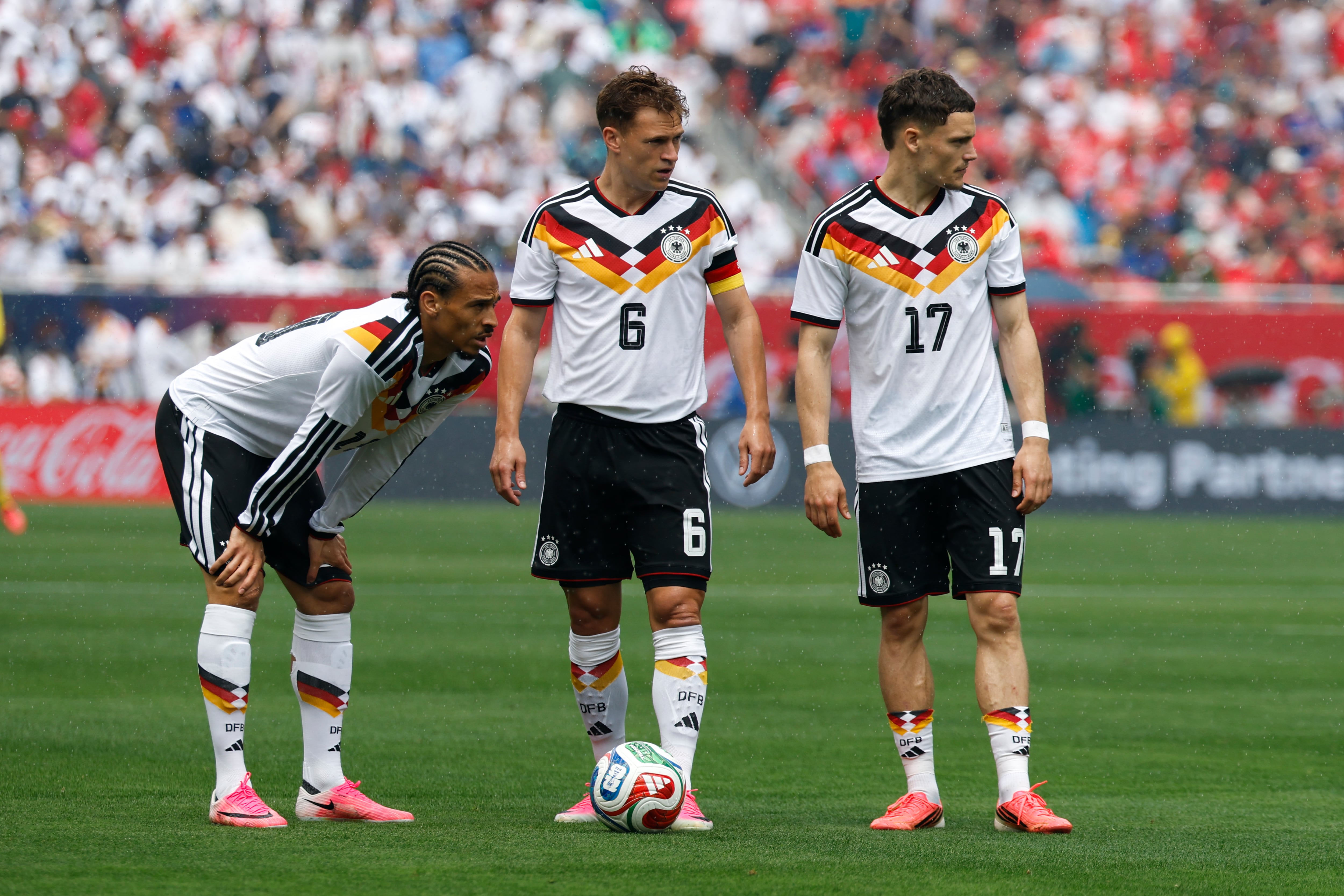 CHICAGO, ILLINOIS - JUNE 6: Leroy Sane #19, Joshua Kimmich #6, and Florian Wirtz #17 of Germany stand over a free kick during the international friendly match between United States and Germany at Soldier Field on June 6, 2026 in Chicago, Illinois. (Photo by Michael Miller/ISI Photos/ISI Photos via Getty Images)