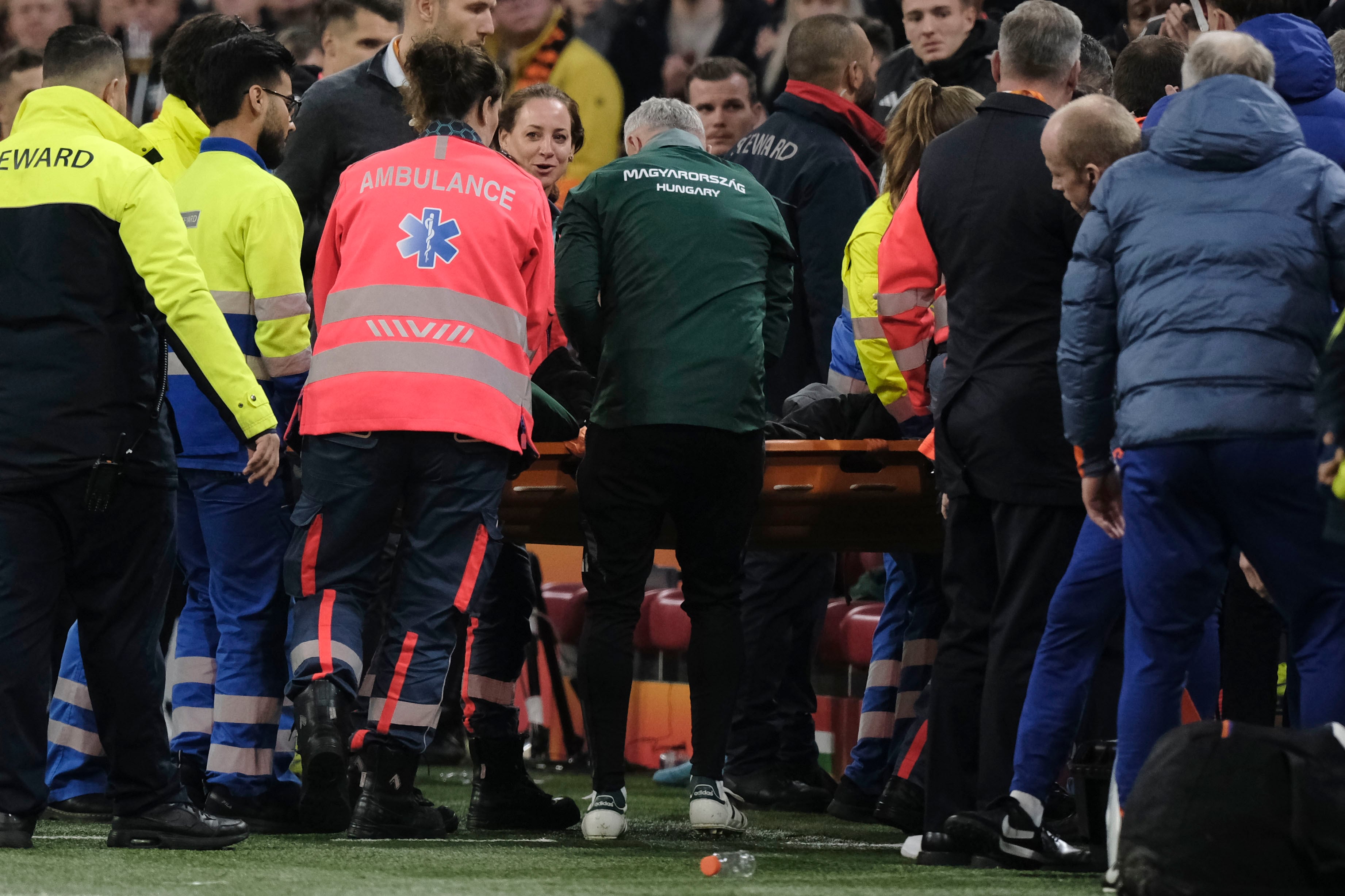 Medics carry Hungary's assistant coach Adam Szalai from the pitch during the UEFA Nations League soccer match between Netherlands and Hungary, at the Johan Cruyff ArenA, in Amsterdam, Netherlands, Saturday, Nov. 16, 2024. (AP Photo/Patrick Post)