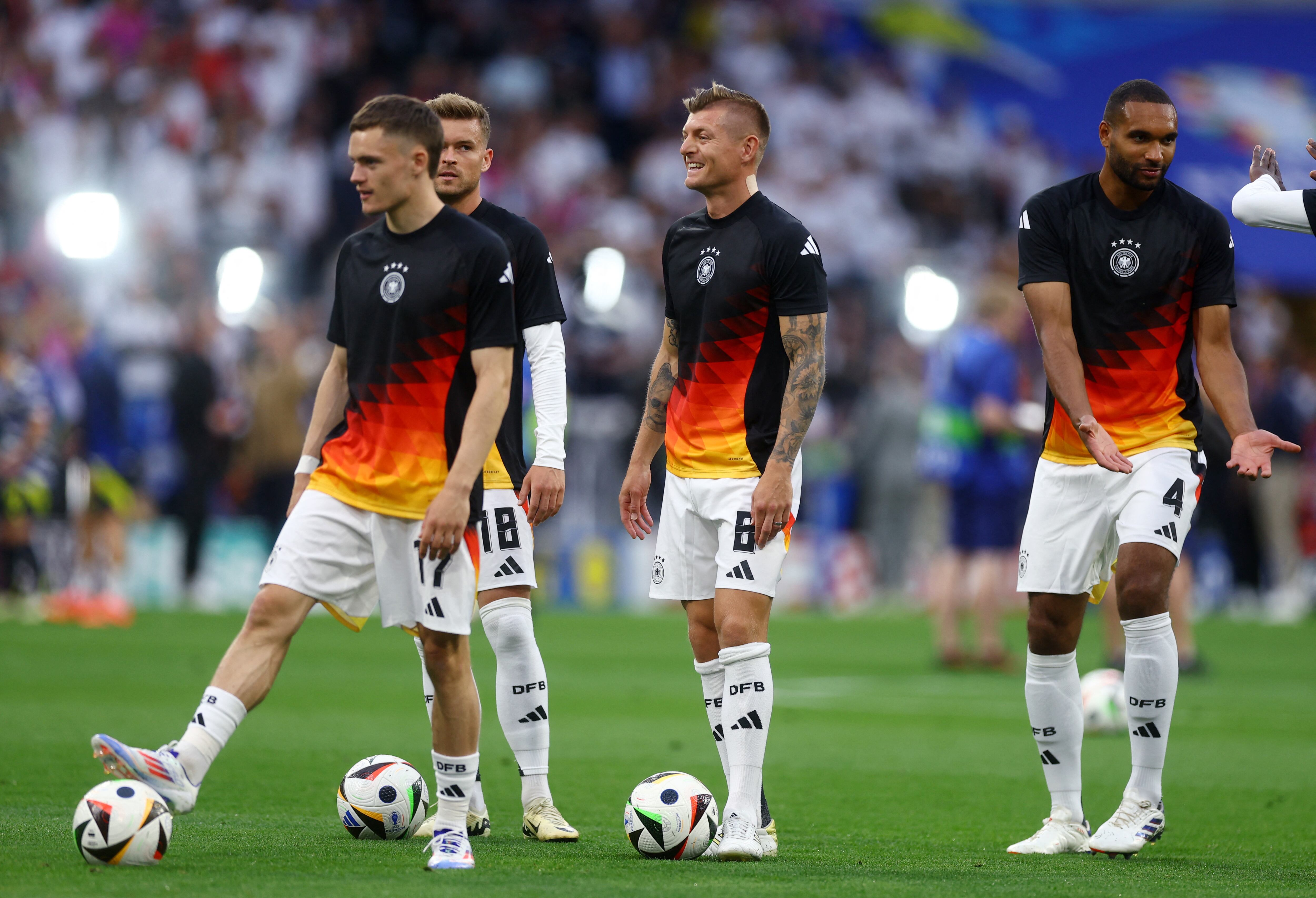 Soccer Football - Euro 2024 - Group A - Germany v Scotland - Munich Football Arena, Munich, Germany - June 14, 2024   Germany's Maximilian Mittelstadt, Toni Kroos, Florian Wirtz and Jonathan Tah during the warm up before the match REUTERS/Lee Smith