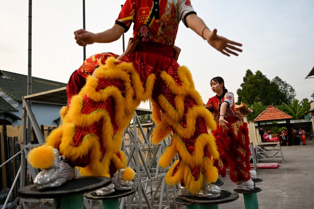 This photograph taken on January 20, 2021 shows female dancers taking part in a practice session at the Tu Anh Duong lion and dragon dance school in Can Tho city in southern Vietnam's Mekong Delta.