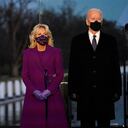 President-elect Joe Biden and Jill listen during a COVID-19 memorial, with lights placed around the Lincoln Memorial Reflecting Pool, Tuesday, Jan. 19, 2021, in Washington. (AP Photo/Alex Brandon)