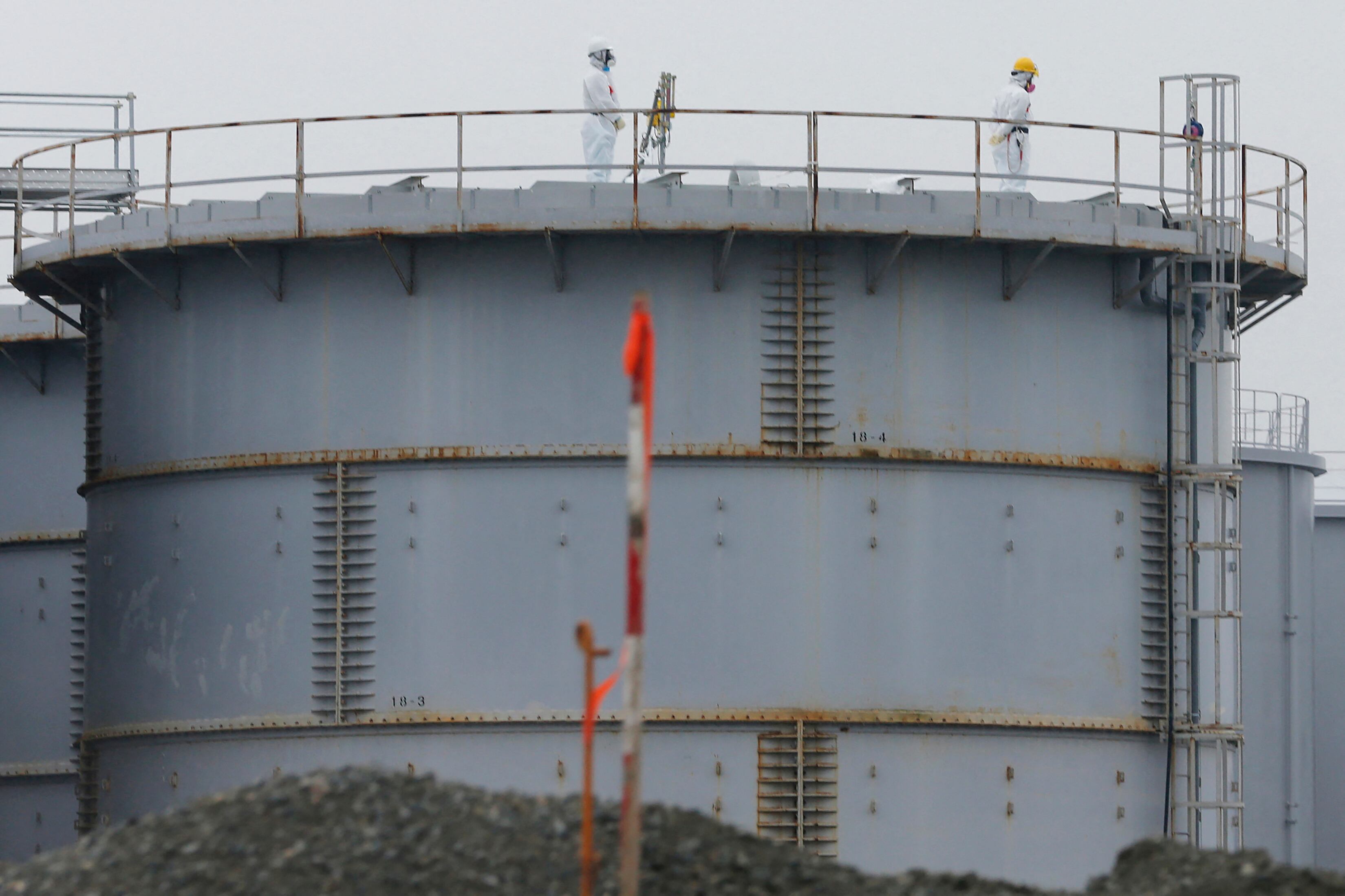 (FILES) This file handout picture released by Tokyo Electric Power Company (TEPCO) and received via Jiji Press on March 21, 2011 shows black smoke rising from reactor number three at the Fukushima Dai-ichi nuclear power plant at Okuma, Fukushima prefecture. Some 12 years after one of the world's worst nuclear disasters, Japan's premier said on August 22, 2023 the release of cooling water from the crippled Fukushima nuclear plant into the Pacific will begin on August 24, despite opposition from fishermen and protests by China. (Photo by Handout / various sources / AFP) / - Japan OUT / -----EDITORS NOTE --- RESTRICTED TO EDITORIAL USE - MANDATORY CREDIT "AFP PHOTO / TEPCO via JIJI PRESS " - NO MARKETING - NO ADVERTISING CAMPAIGNS - DISTRIBUTED AS A SERVICE TO CLIENTS