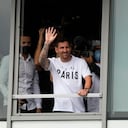 Lionel Messi waves after arriving at Le Bourget airport, north of Paris, Tuesday, Aug. 10, 2021. Lionel Messi finalized agreement on his Paris Saint-Germain contract and was flying to France on Tuesday to complete the move that confirms the end of a career-long association with Barcelona. (AP Photo/Francois Mori)