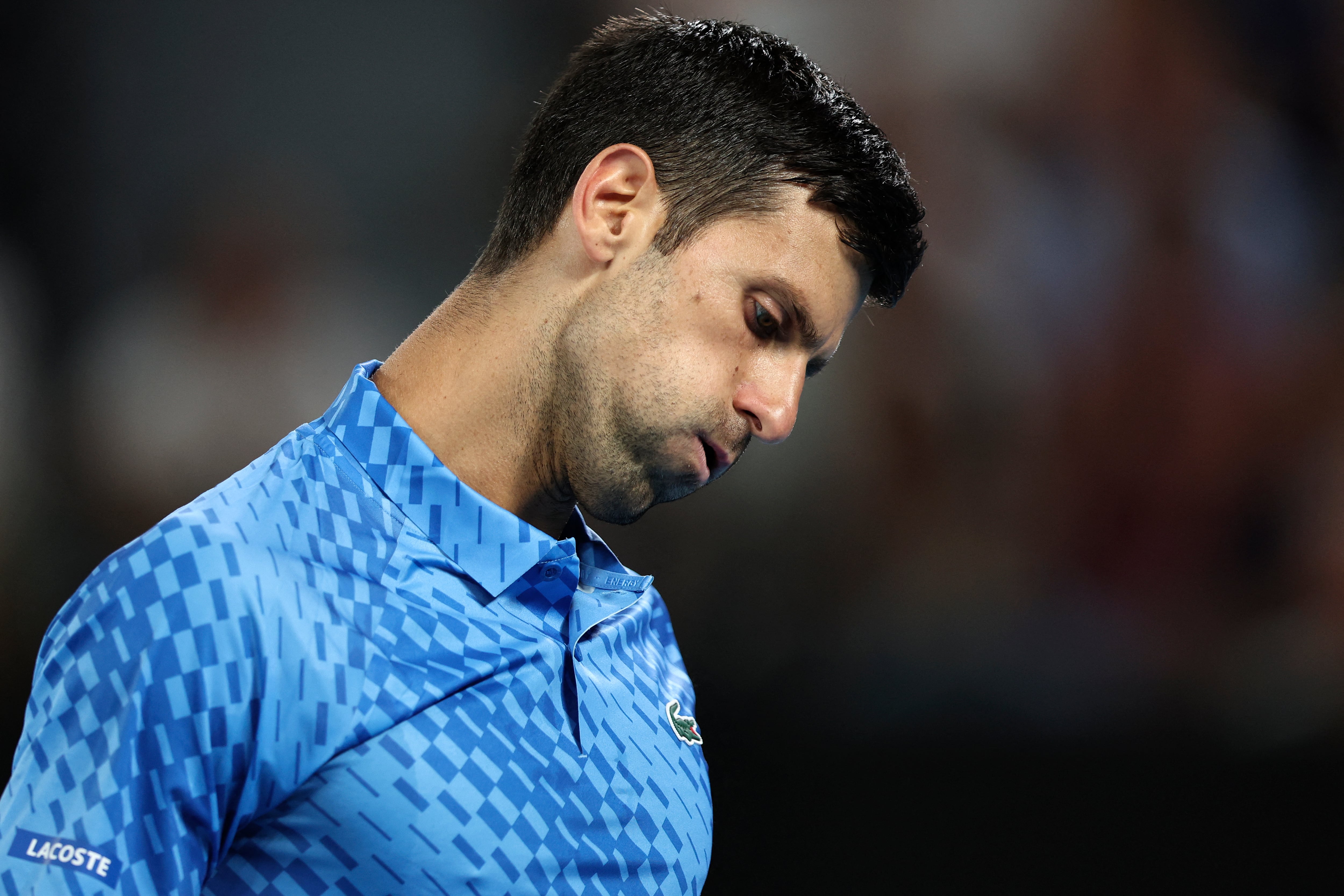 Serbia's Novak Djokovic reacts on a point against Spain's Roberto Carballes Baena during their men's singles match on day two of the Australian Open tennis tournament in Melbourne on January 17, 2023. (Photo by Martin KEEP / AFP) / -- IMAGE RESTRICTED TO EDITORIAL USE - STRICTLY NO COMMERCIAL USE --