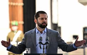 Chile's President Gabriel Boric delivers a speech during the presentation of the National Search Plan for the Disappeared to find missing victims of the 1973-1990 dictatorship, in Santiago on August 30, 2023, on International Day of the Victims of Enforced Disappearance. Chile on Wednesday launched a National Search Plan for the Disappeared, the first official initiative 50 years after Augusto Pinochet's coup to gather information on the fate of the 1,162 people whose whereabouts are unknown. (Photo by Martin BERNETTI / AFP)