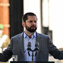 Chile's President Gabriel Boric delivers a speech during the presentation of the National Search Plan for the Disappeared to find missing victims of the 1973-1990 dictatorship, in Santiago on August 30, 2023, on International Day of the Victims of Enforced Disappearance. Chile on Wednesday launched a National Search Plan for the Disappeared, the first official initiative 50 years after Augusto Pinochet's coup to gather information on the fate of the 1,162 people whose whereabouts are unknown. (Photo by Martin BERNETTI / AFP)
