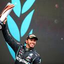 Winner Mercedes' British driver Lewis Hamilton celebrates on the podium after the Turkish Formula One Grand Prix at the Intercity Istanbul Park circuit in Istanbul on November 15, 2020. (Photo by TOLGA BOZOGLU / POOL / AFP)