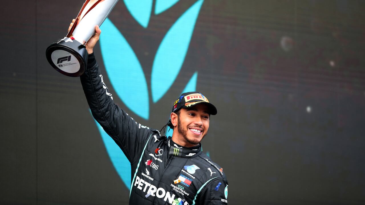 Winner Mercedes' British driver Lewis Hamilton celebrates on the podium after the Turkish Formula One Grand Prix at the Intercity Istanbul Park circuit in Istanbul on November 15, 2020. (Photo by TOLGA BOZOGLU / POOL / AFP)