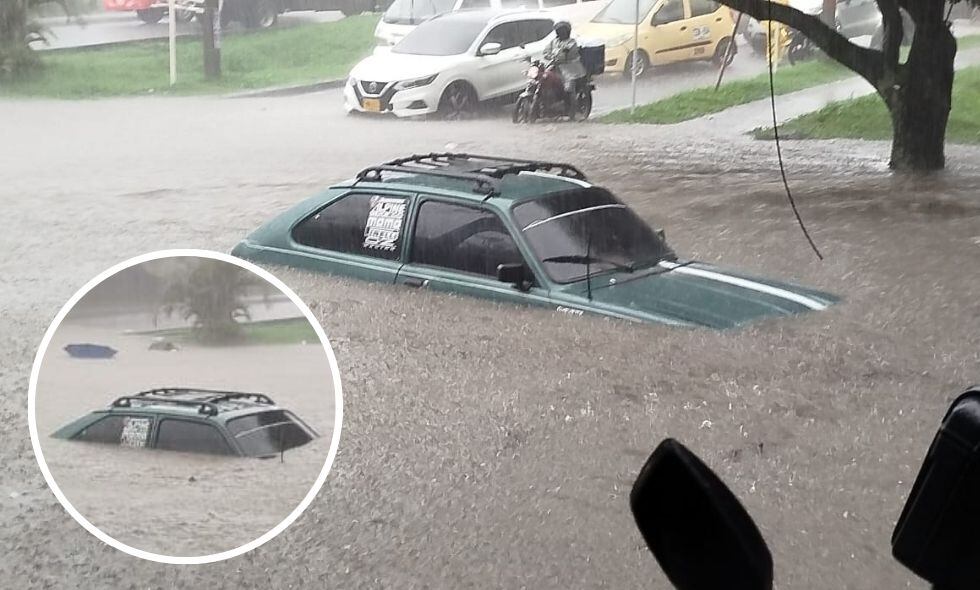 Carro atrapado en la Avenida 4 norte por las fuertes lluvias en Cali.