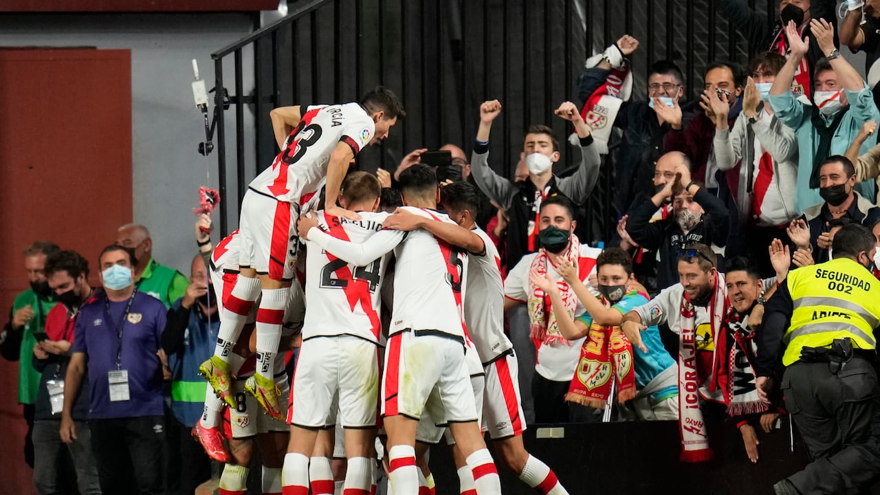 Rayo's Radamel Falcao celebrates after scoring his side's opening goal with his teammates during a Spanish La Liga soccer match between Rayo Vallecano and FC Barcelona at the Vallecas stadium in Madrid, Spain, Wednesday, Oct. 27, 2021. (AP Photo/Manu Fernandez)