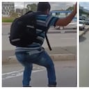 Hombre lanzándose de un bus de TransMilenio en movimiento.