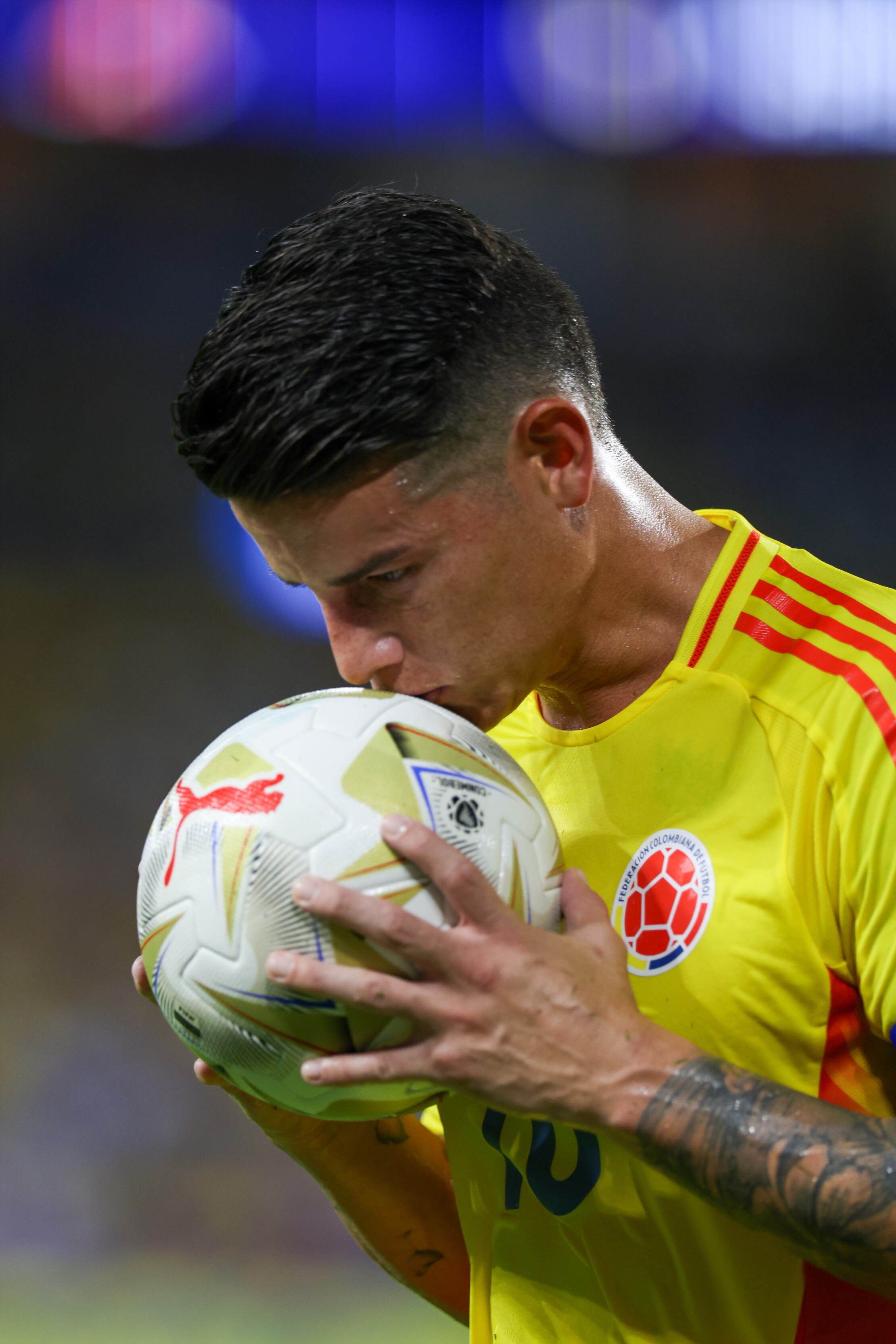 MIAMI GARDENS, FLORIDA - JULY 14: James Rodriguez #10 of Colombia kisses the ball before taking a corner kick during a game between Colombia and Argentina at Hard Rock Stadium on July 14, 2024 in Miami Gardens, FL. (Photo by Roger Wimmer/ISI Photos/Getty Images)