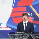 In this handout picture released by the UEFA, Russian former international forward Andrey Arshavin poses by the trophy during the Champions League round of 16 draw at the UEFA headquarters in Nyon, on December 13, 2021. - The first legs are scheduled for 15/16/22/23 February, with the second legs on 8/9/15/16 March. (Photo by Richard JUILLIART / UEFA / AFP) / RESTRICTED TO EDITORIAL USE - MANDATORY CREDIT "AFP PHOTO / UEFA / Richard Juilliart" - NO MARKETING - NO ADVERTISING CAMPAIGNS - DISTRIBUTED AS A SERVICE TO CLIENTS