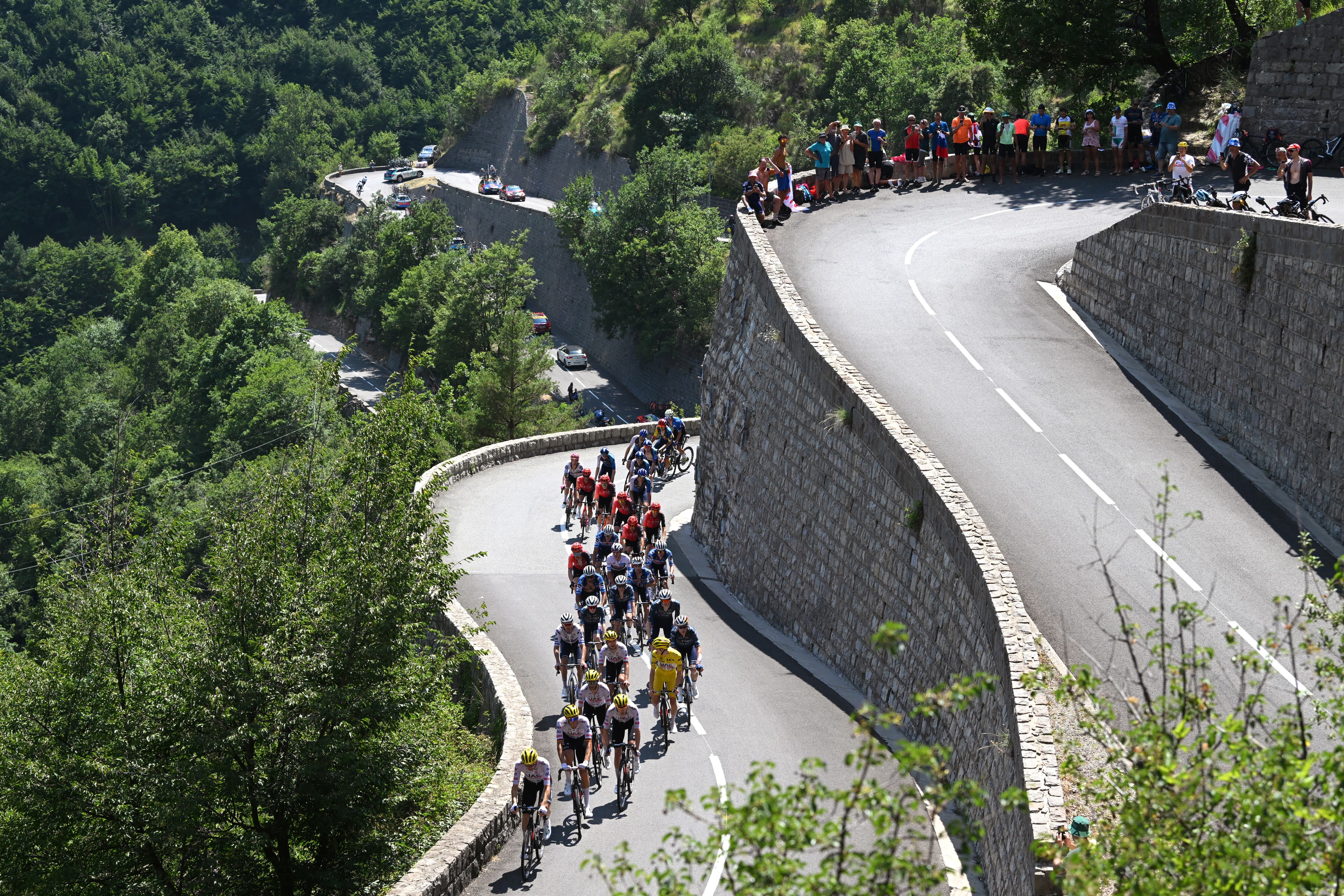 COL DE LA COUILLOLE, FRANCE - JULY 20: A general view of Tim Wellens of Belgium, Nils Politt of Germany, Pavel Sivakov of France, Adam Yates of The United Kingdom, Tadej Pogacar of Slovenia and UAE Team Emirates - Yellow Leader Jersey, Wout Van Aert of Belgium, Matteo Jorgenson of The United States and Team Visma | Lease a Bike, Christophe Laporte of France Bart Lemmen of Netherlands and Team Visma | Lease a Bike, Mikel Landa of Spain and Team Soudal Quick-Step and the peloton compete climbing to the Col de Turini (1601m) during the 111th Tour de France 2024, Stage 20 a 132.8km stage from Nice to Col de la Couillole 1676m / #UCIWT / on July 20, 2024 in Col de la Couillole, France. (Photo by Dario Belingheri/Getty Images)