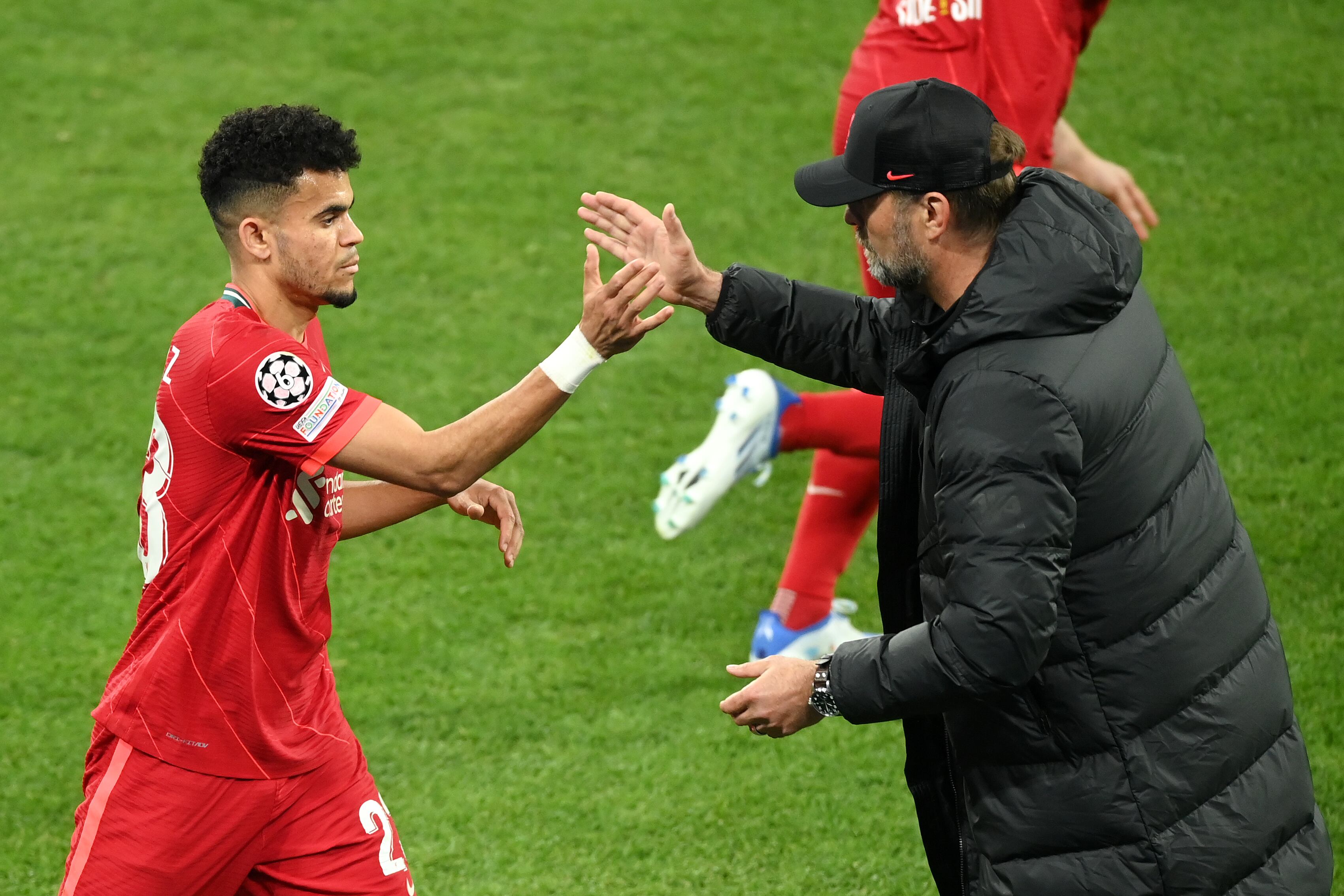 PARIS, FRANCE - MAY 28: Luis Diaz embraces Juergen Klopp, Manager of Liverpool after they are substituted during the UEFA Champions League final match between Liverpool FC and Real Madrid at Stade de France on May 28, 2022 in Paris, France. (Photo by Matthias Hangst/Getty Images)