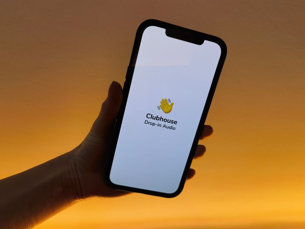 25 January 2021, Berlin: A user of the social media app Clubhouse shows her smartphone with the logo of the audio application. Photo: Christoph Dernbach/dpa (Photo by Christoph Dernbach/picture alliance via Getty Images)