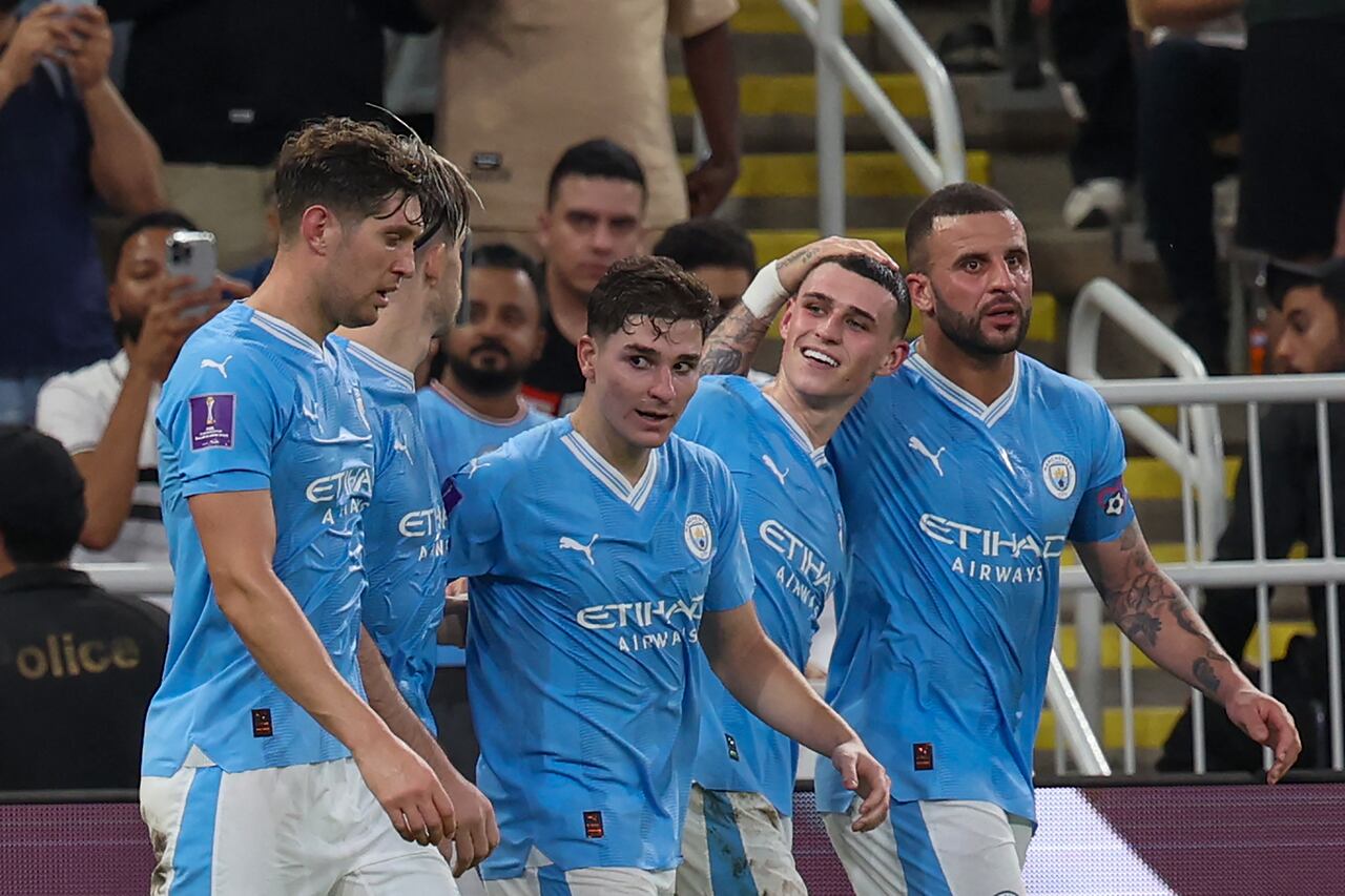 Manchester City's English midfielder #47 Phil Foden (2R) celebrates after with teammates scoring their third goal during the FIFA Club World Cup 2023 football final match between England's Manchester City and Brazil's Fluminense at King Abdullah Sports City Stadium in Jeddah on December 22, 2023. (Photo by Giuseppe CACACE / AFP)